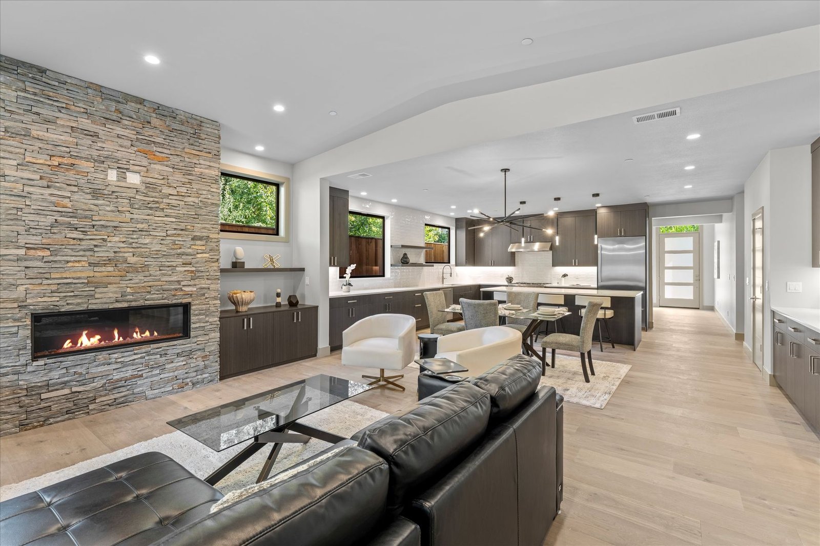 Living room with stacked stone fireplace