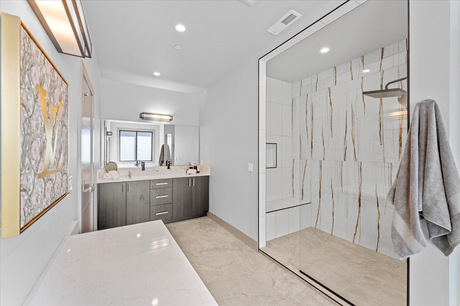 Primary bathroom with marble tile